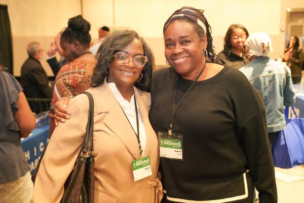 Cheryl Burns (left), Chief of the Housing Choice Voucher (HCV) department, with property owner Karen Forte
