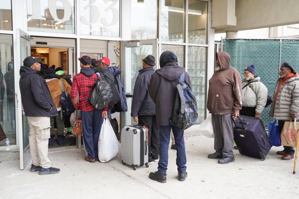 CHA clients lined up outside the Patrick Sullivan Apartments