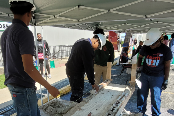 Construction workers poour concrete